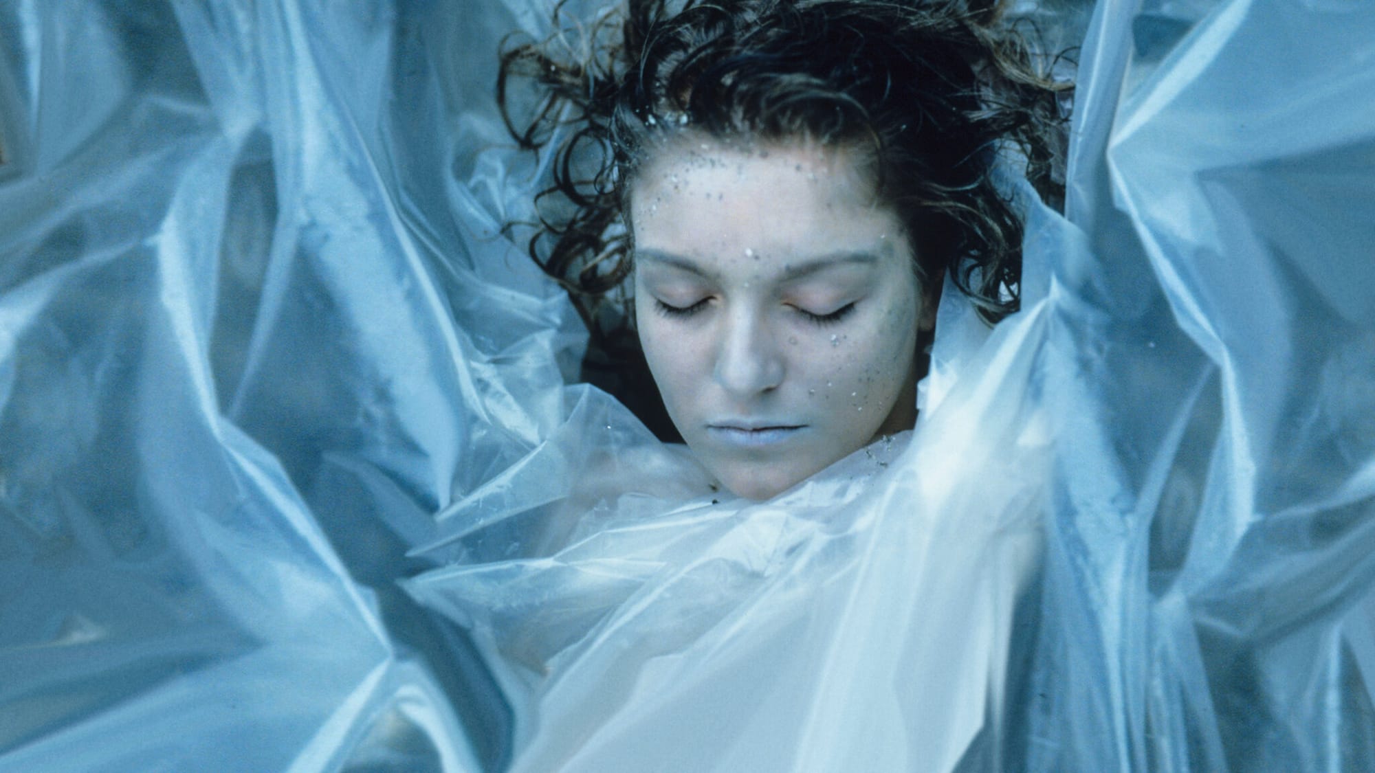 Laura Palmer wrapped in plastic, her lips blue.